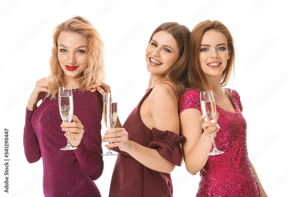 Happy young women with glasses of champagne on white background Happy young women with glasses of champagne on white background