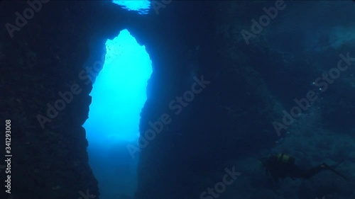 Wallpaper Mural scuba divers are exploring the caves underwater cave dive ocean scenery with torch lights Torontodigital.ca