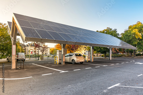 Bild auf Leinwand Car charging station for self-sufficient and first photovoltaic panels in Europe