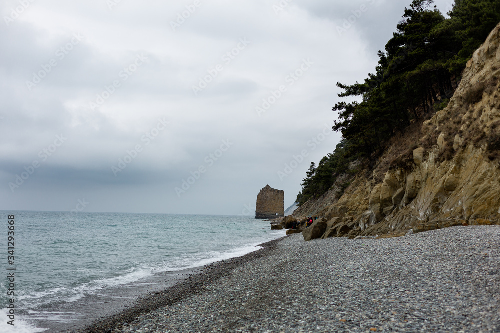 Stones beach at the sea in dark day