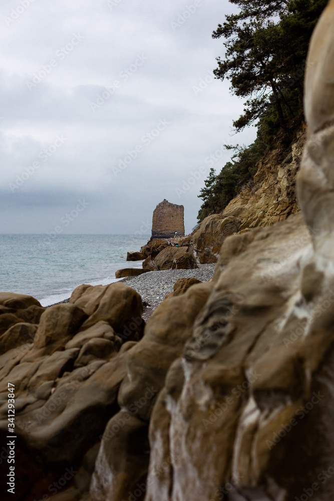 Stones beach at the sea in dark day