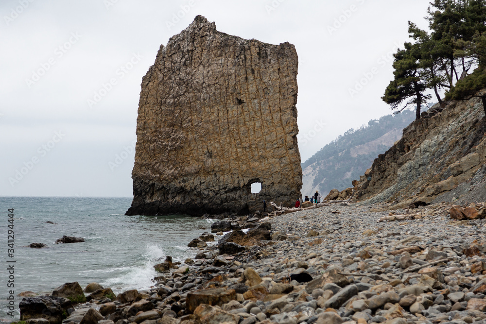 Stones beach at the sea in dark day Stones beach at the sea in dark day