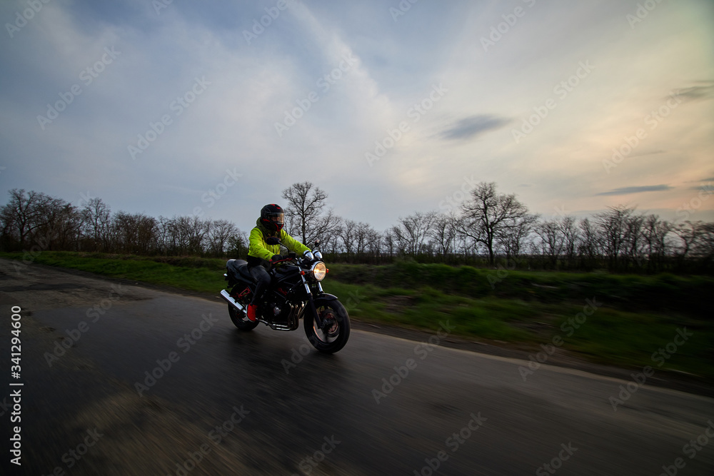 man rides a motorcycle on a highway