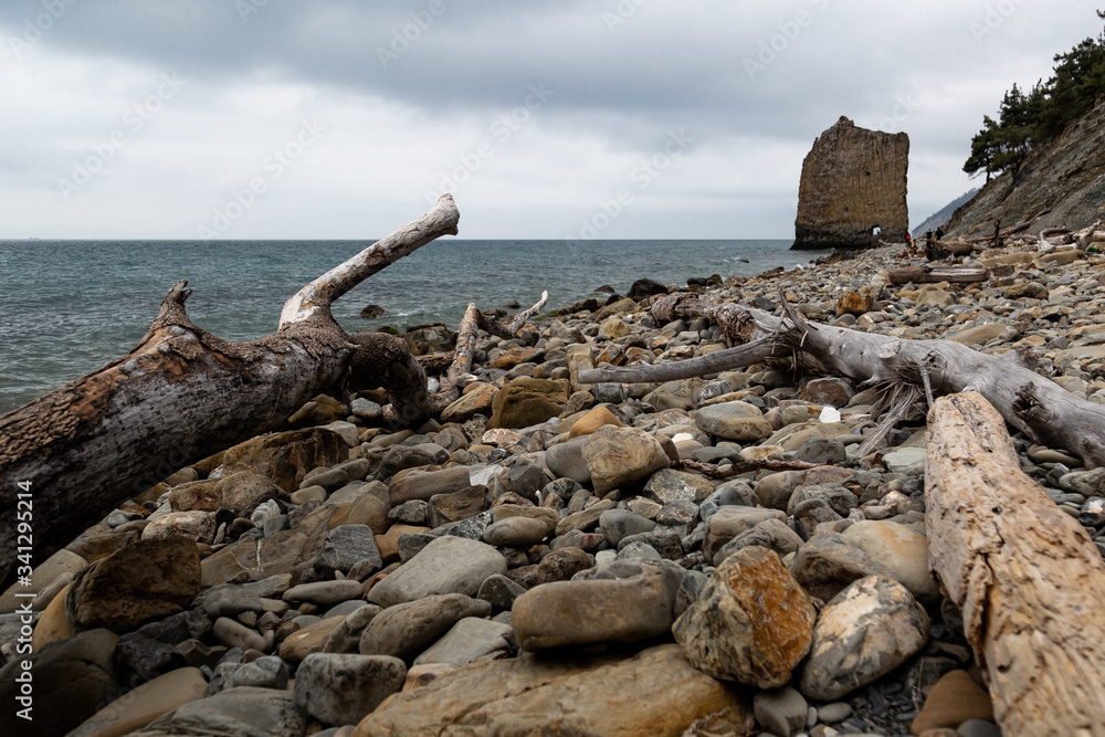 Stones beach at the sea in dark day Stones beach at the sea in dark day