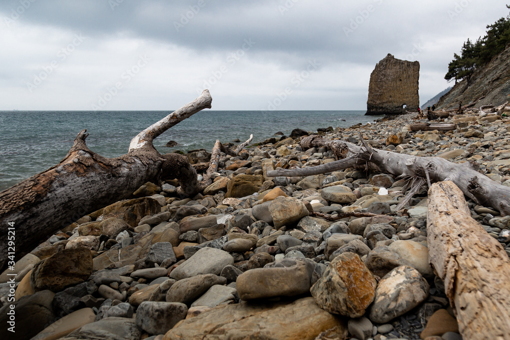 Stones beach at the sea in dark day