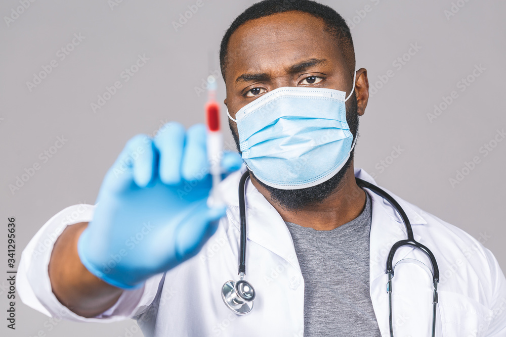 Worried african american doctor man in gown face mask gloves isolated on gree background. Epidemic pandemic coronavirus 2019-ncov sars covid-19 flu virus. Holding blood test result. Worried african american doctor man in gown face mask gloves isolated on gree background. Epidemic pandemic coronavirus 2019-ncov sars covid-19 flu virus. Holding blood test result.