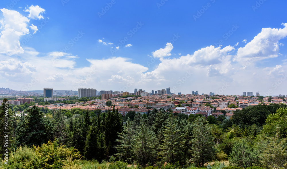 Ankara, Turkey - July 24, 2018: View above of Ankara houses with tiled roofs and skyscrapers