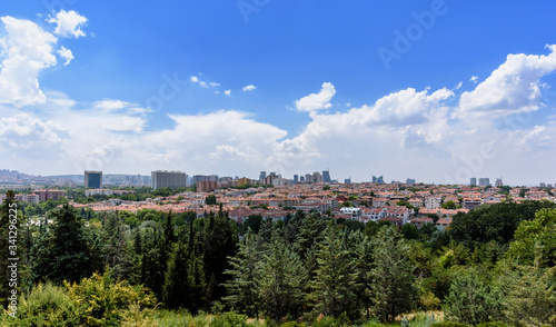 Ankara, Turkey - July 24, 2018: View above of Ankara houses with tiled roofs and skyscrapers