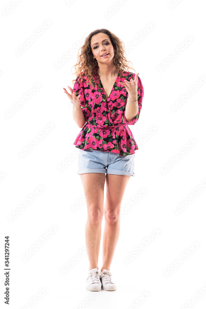 Adorable pretty girl speaking at camera babbling and chattering while gesticulating trying to explain. Full body isolated on white background. Adorable pretty girl speaking at camera babbling and chattering while gesticulating trying to explain. Full body isolated on white background.