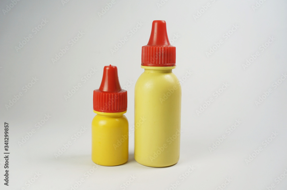 Two Yellow plastic bottle antiseptic isolated on white background. Antiseptic drug to kill germs that cause infections. Two Yellow plastic bottle antiseptic isolated on white background. Antiseptic drug to kill germs that cause infections.