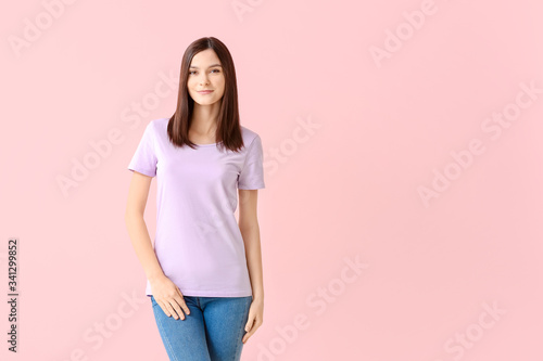 Woman in stylish t-shirt on color background © Pixel-Shot