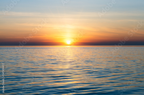 scenic ocean landscape, golden sunset or sunrise at sea