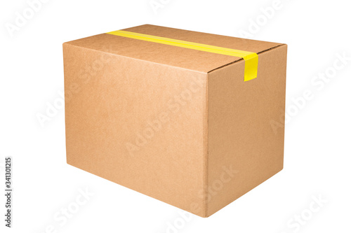 Blank cardboard box with yellow sticky tape isolated on white background. Carton box taped with sticky tape isolated on white background