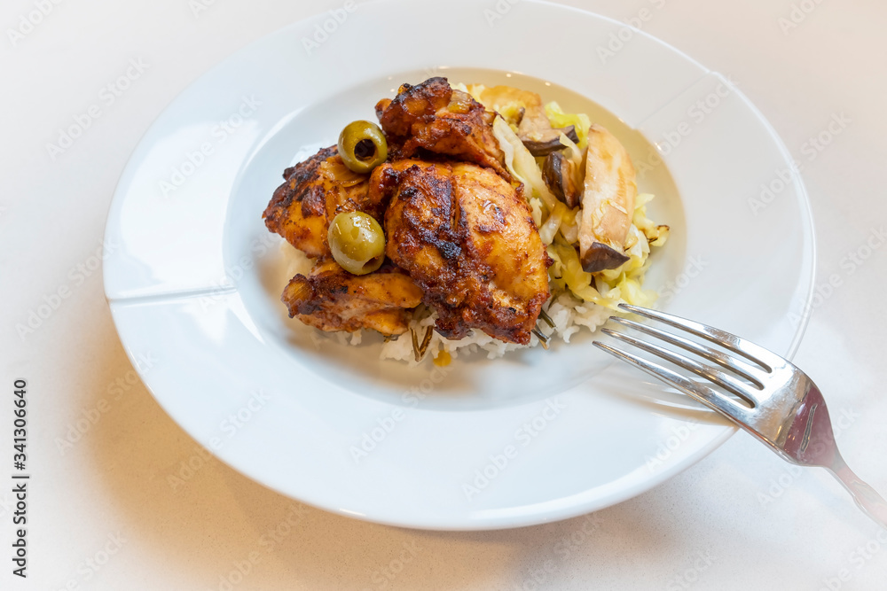 Moroccan Chicken Served on Bed of Rice Accompanied with Cabbage and King Oyster Mushroom Moroccan Chicken Served on Bed of Rice Accompanied with Cabbage and King Oyster Mushroom
