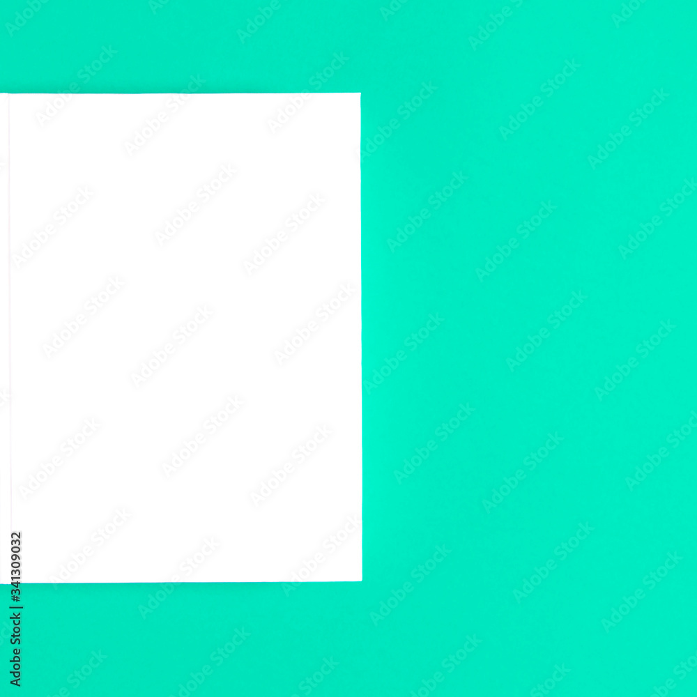 Mockup of closed blank square book at white textured paper Mockup of closed blank square book at white textured paper
