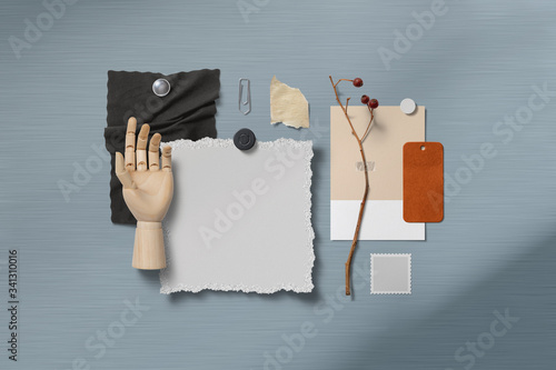 moodboard with paper items pinned with magnets