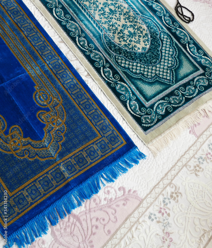 Prayer rugs on a carpet in a house, Prayer rugs on a carpet in a house,