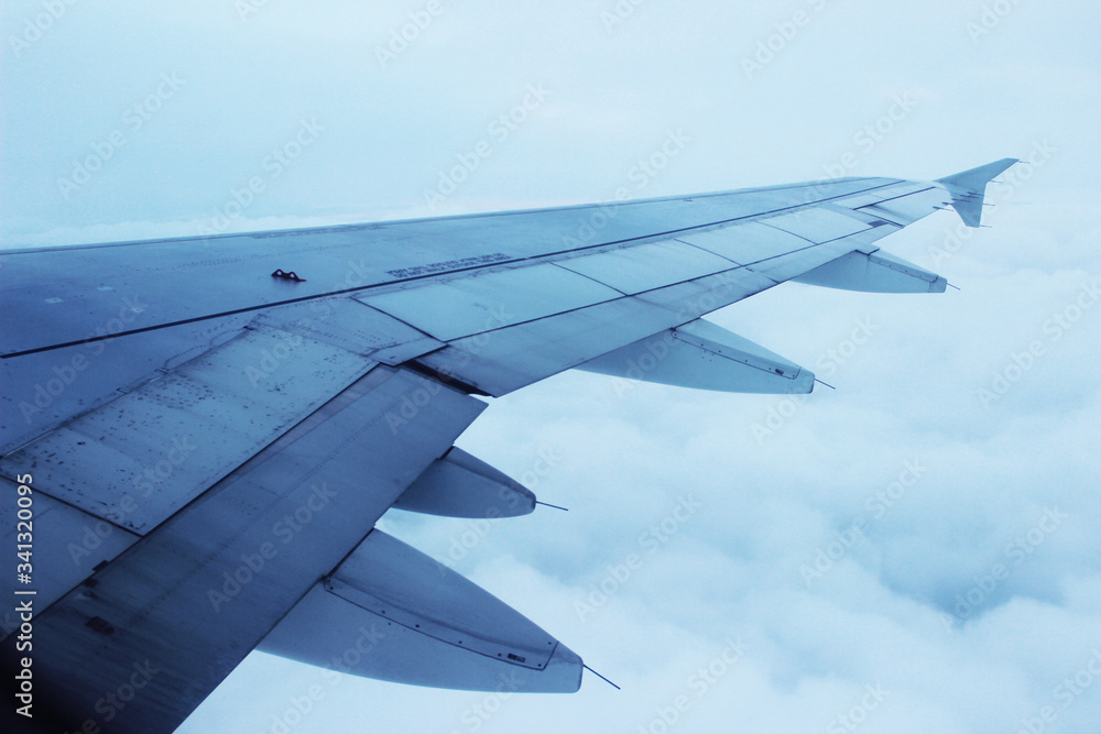 Wing of the plane cloudy sky background Wing of the plane cloudy sky background