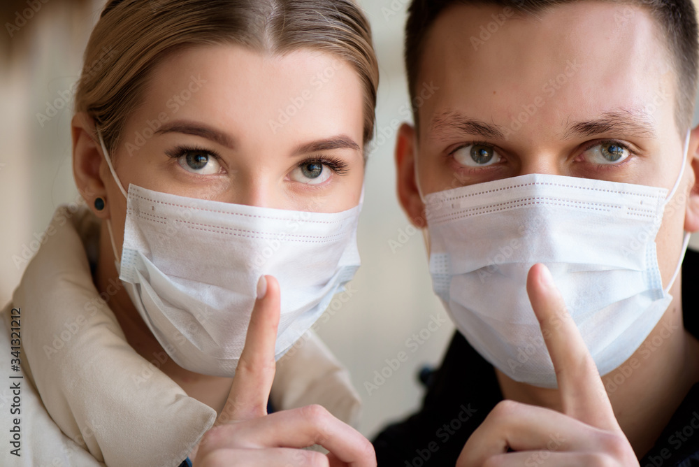 Family in face mask in shopping mall or airport. Couple wear facemask during coronavirus and flu outbreak. Virus and illness protection in public crowded place. Family in face mask in shopping mall or airport. Couple wear facemask during coronavirus and flu outbreak. Virus and illness protection in public crowded place.