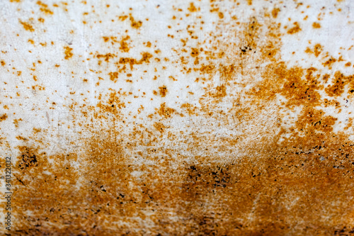 Metal surface with white paint that has passed temporary damage, a lot of formed, red rust. Textured background with traces of destruction and deformation