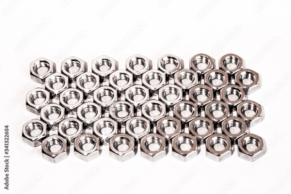 Screw, bolt and nut in black and white for industrial background. Pattern of metal nuts. Metal nuts on white background. Chromed nuts isolated. Steel nuts isolated. Tools for work Screw, bolt and nut in black and white for industrial background. Pattern of metal nuts. Metal nuts on white background. Chromed nuts isolated. Steel nuts isolated. Tools for work