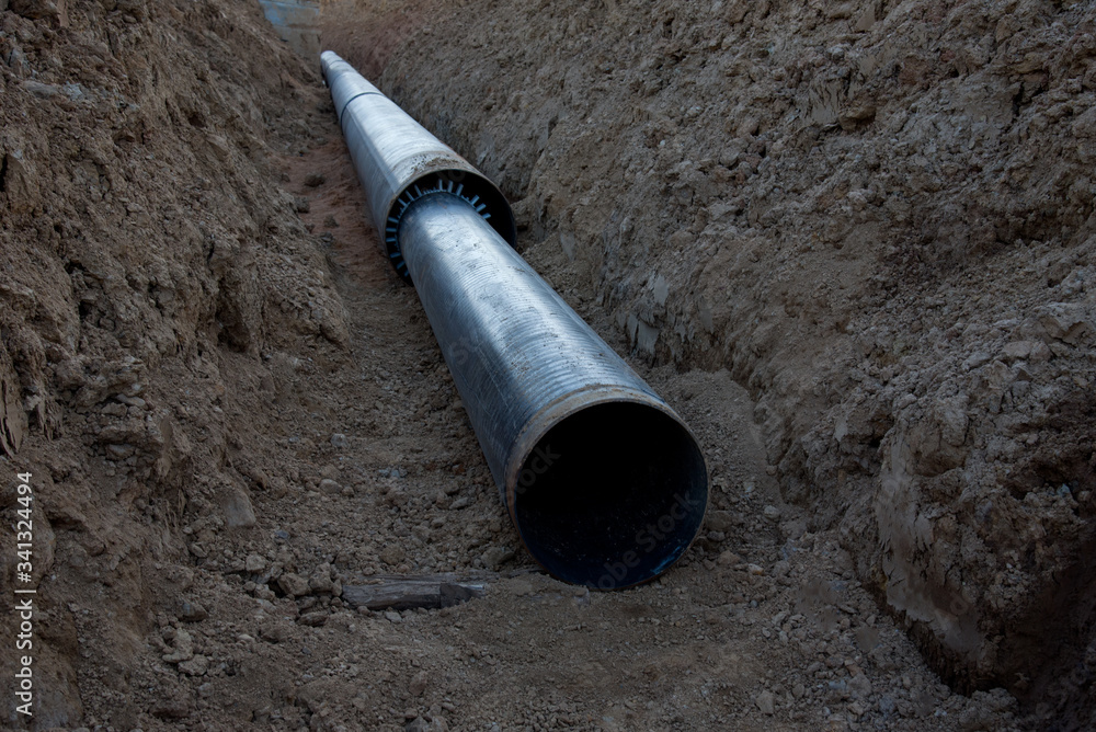 Sewer pipes for laying an external sewage system at a construction site. Sanitary drainage system for a multi-story building. Civil infrastructure pipe, water lines and storm sewers Sewer pipes for laying an external sewage system at a construction site. Sanitary drainage system for a multi-story building. Civil infrastructure pipe, water lines and storm sewers
