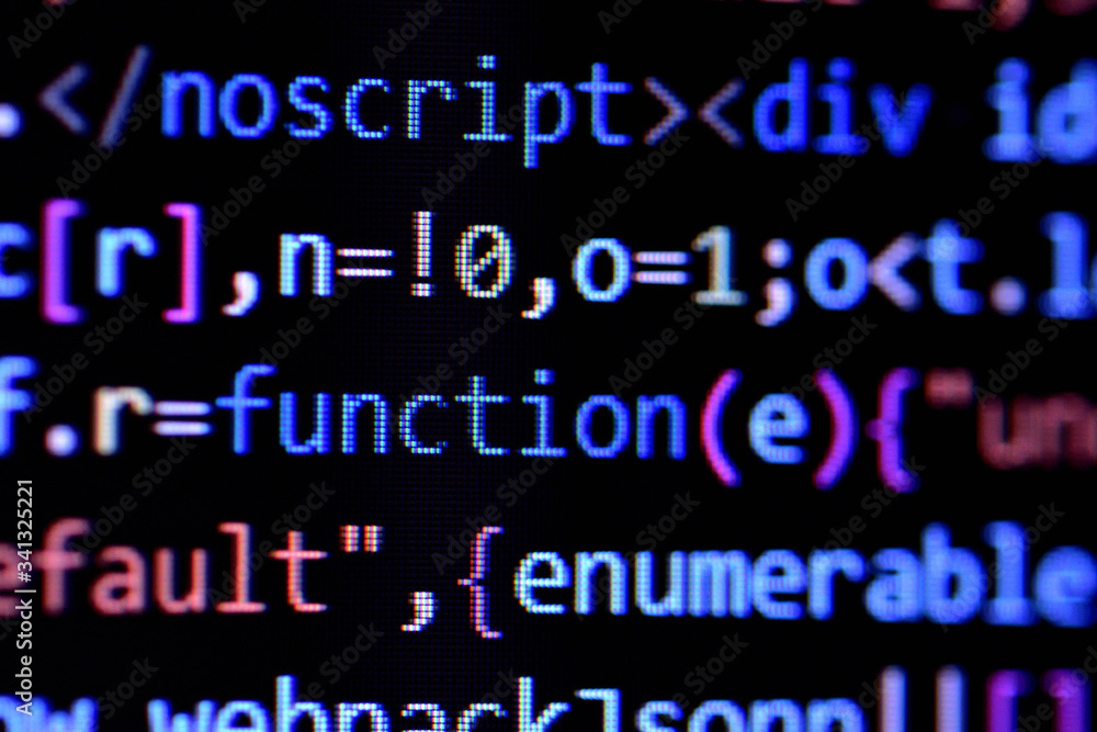 Close-up of minified javascript file. Computer programming source code for HTML website development.