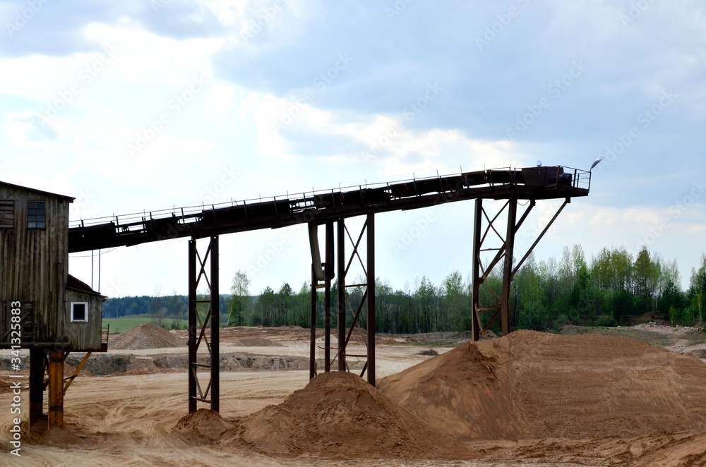 Sand making plant in mining quarry. Crushing factory with production line for crushing, grinding stone, sorting sand and bulk materials. Sand washing for the construction industry