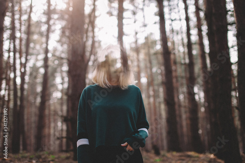 young girl in the woods without a face