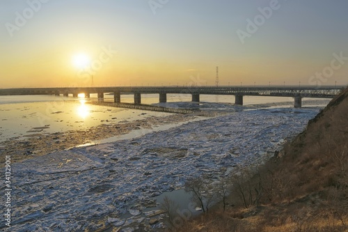 Ice drift on the Amur river at sunset. Amur bridge area. Trans siberian railway. Khabarovsk  far East  Russia.