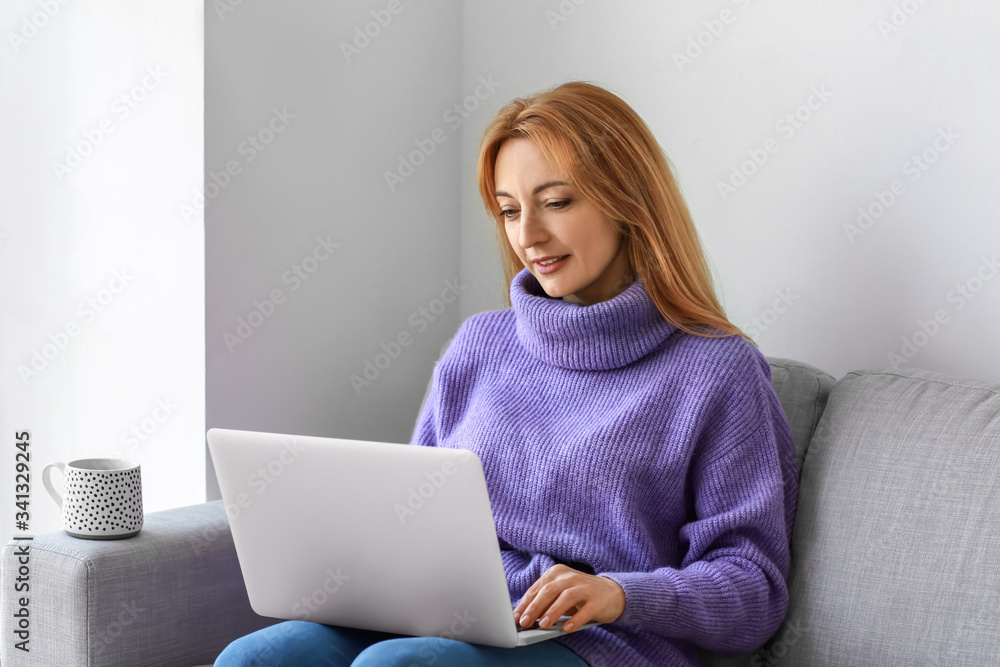 Mature woman using laptop for online learning at home Mature woman using laptop for online learning at home