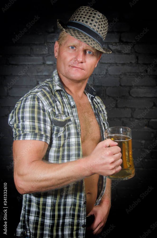 Attractive man and a light beer. Attractive man and a light beer.