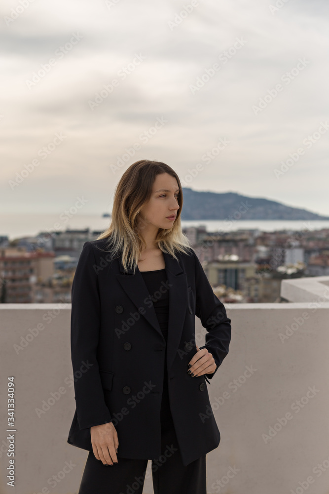 Fototapeta premium Self-confident business woman wearing elegant black suit