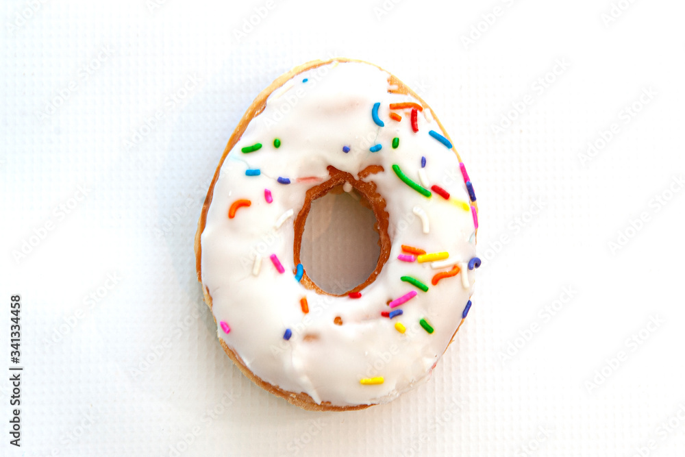 donut with icing and rainbow sprinkles