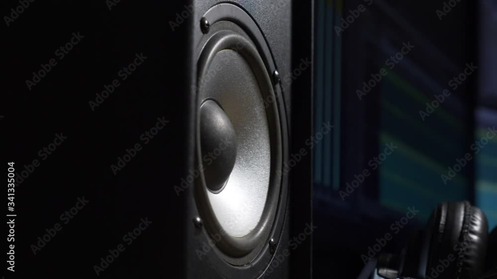 Speaker Vibrating Playing Loud Music Beat Near Computer Monitor at Home Recording Studio Speaker Vibrating Playing Loud Music Beat Near Computer Monitor at Home Recording Studio
