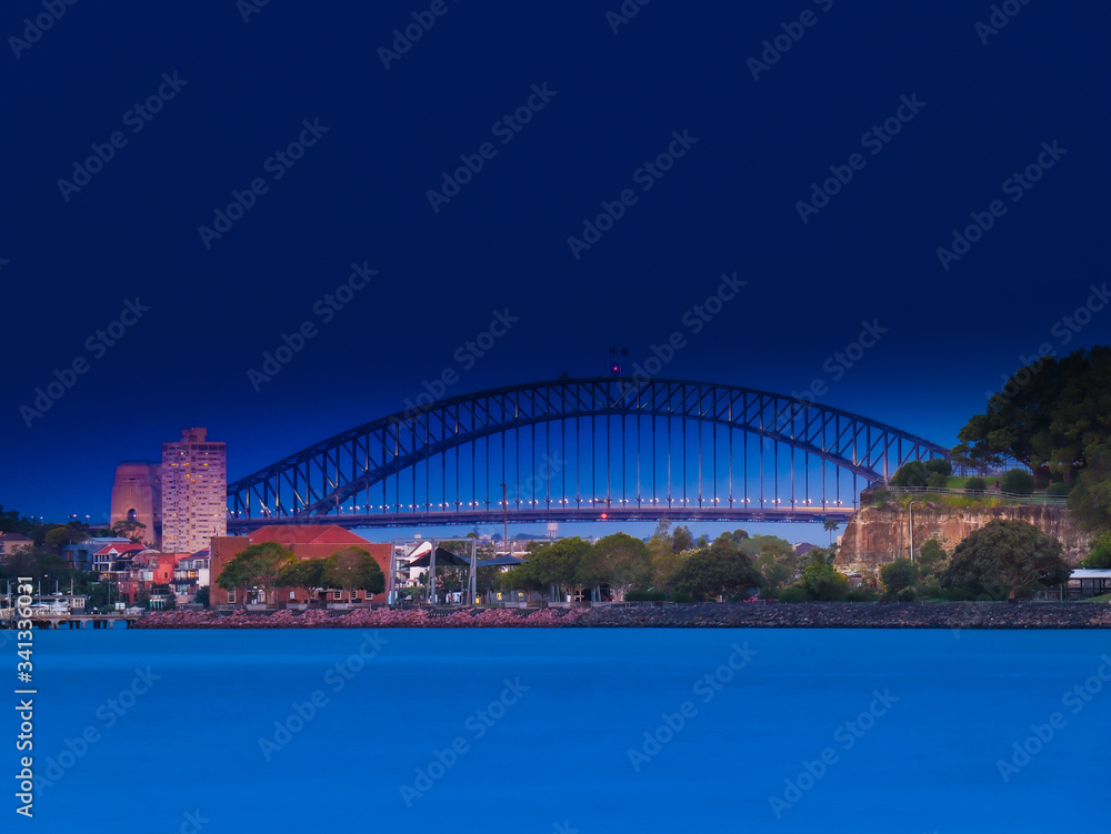 Fototapeta premium Drone Panoramic Aerial view of Sydney Harbour and the beautiful vibrant colours of the afternoon showing smooth harbour waters 