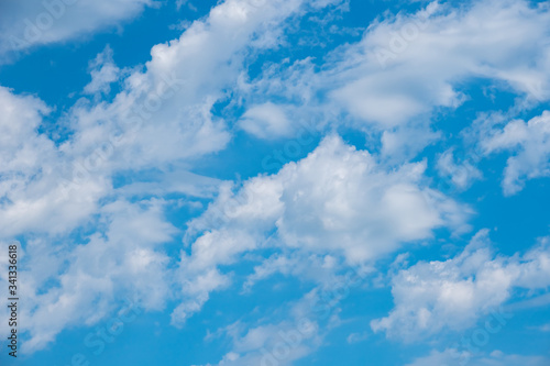 Blue sky background with white clouds, texture