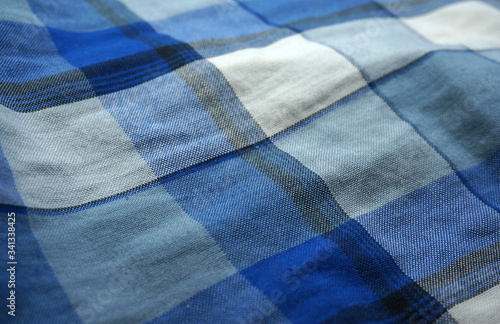 Sarong cloth texture background. Indonesia sarong cloth. Blue, white and black striped. Square desaign. 