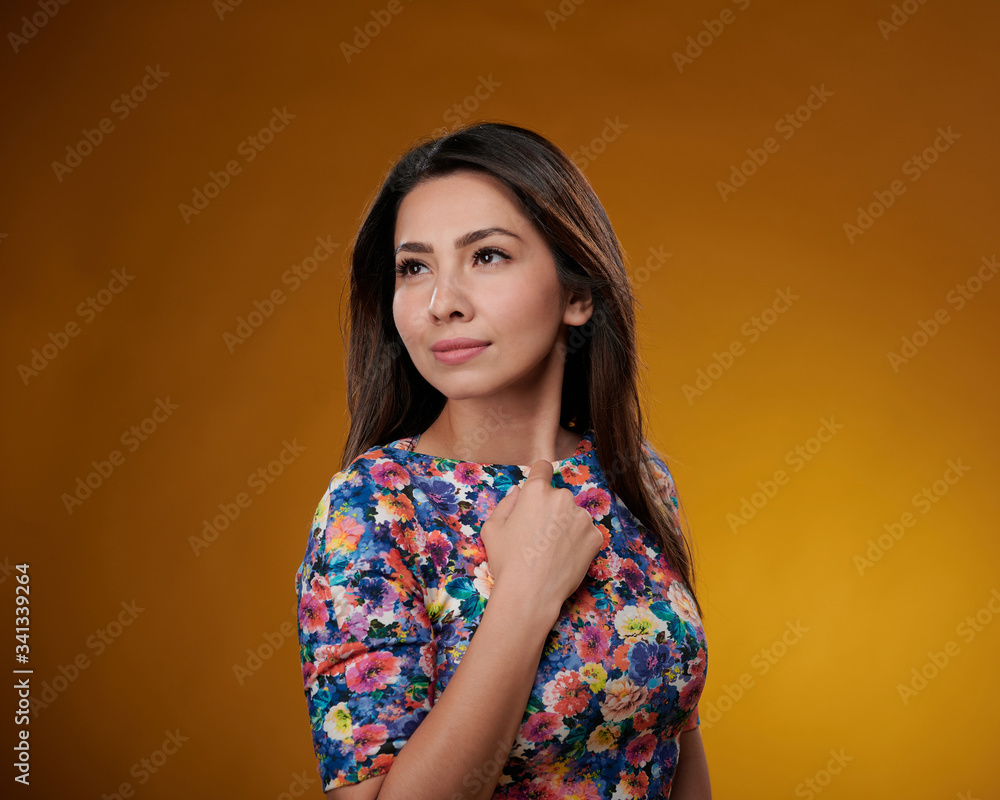 Attractive young woman dark hair posing yellow background Attractive young woman dark hair posing yellow background