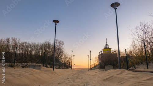 Entrance to the beach on the Stogi beach, Gdansk, Poland. Baltic Sea. Sunrise. 