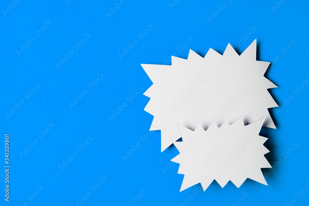 Blank promotional starburst sales banner on a bright blue background Blank promotional starburst sales banner on a bright blue background