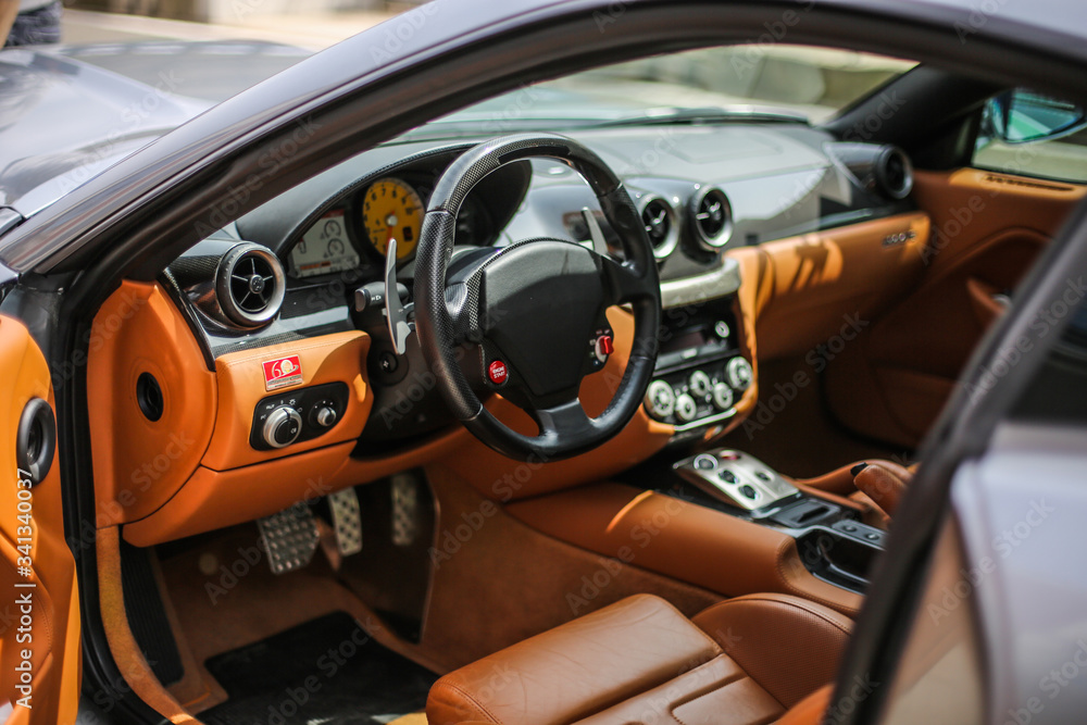 Orange color interior of a car with leather seats
