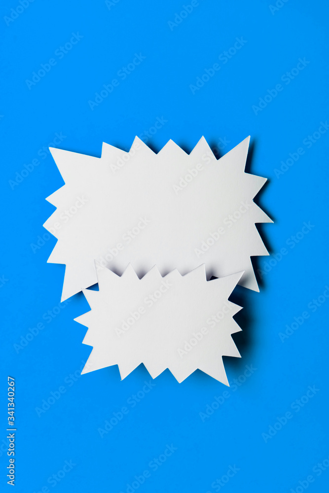 Blank promotional starburst sales banner on a bright blue background Blank promotional starburst sales banner on a bright blue background