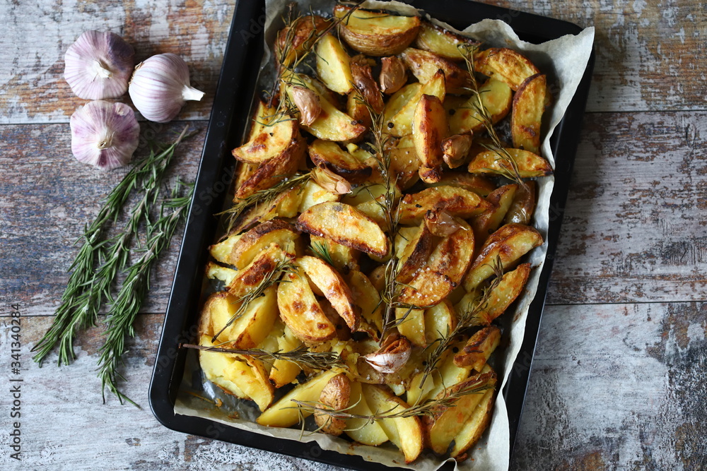 Baked Potato with Rosemary and Garlic. Cooking at home. Baked Potato with Rosemary and Garlic. Cooking at home.