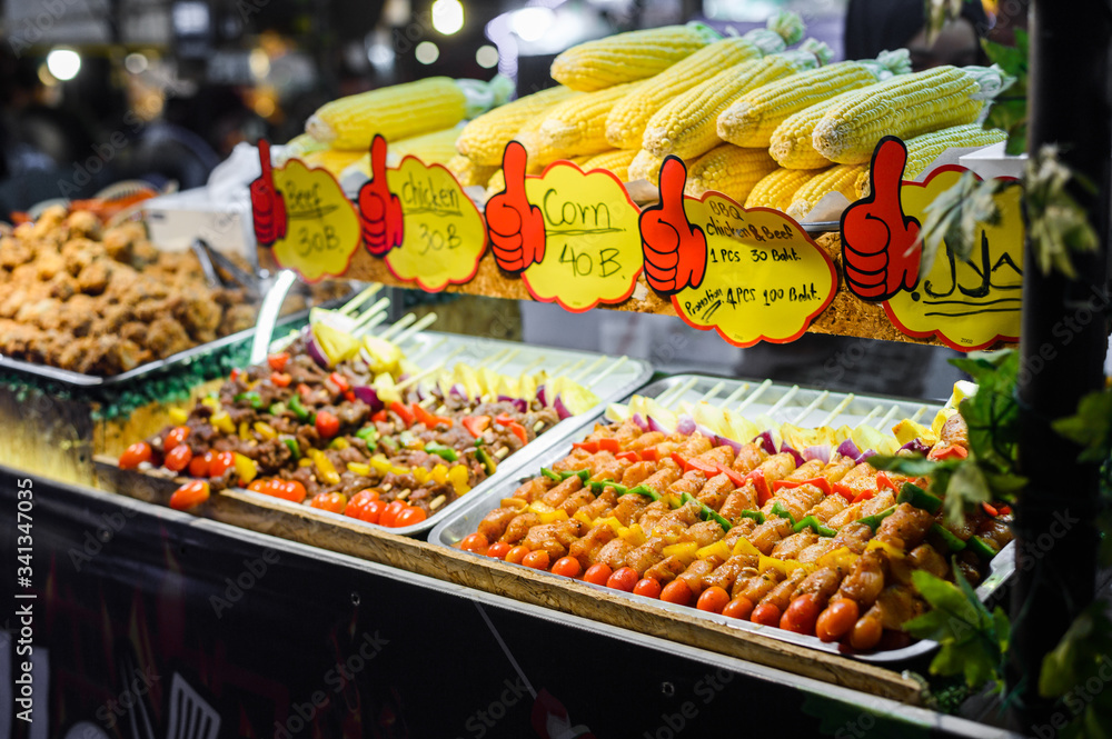Skewers of grilled vegetables and meat in night market, thailand