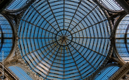 Fototapeta Naklejka Na Ścianę i Meble -  The dome of Galleria Umberto I. Galleria Umberto I is a public shopping gallery in Naples, a high and spacious cross-shaped structure, surmounted by a glass dome.
