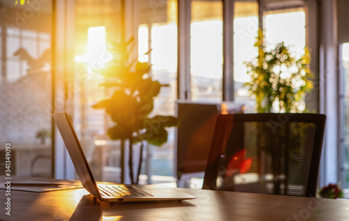 Fototapeta Naklejka Na Ścianę i Meble -  Notebook on desk in sunlight.