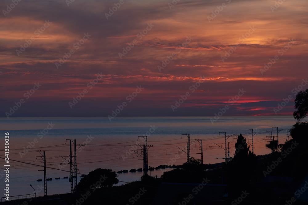 Naklejka premium Beautiful pink sea sunset natural contrast sea and sky