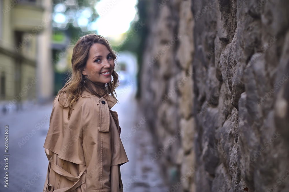 Fototapeta premium spring portrait of a girl with beautiful bokeh, happy beautiful woman on a walk