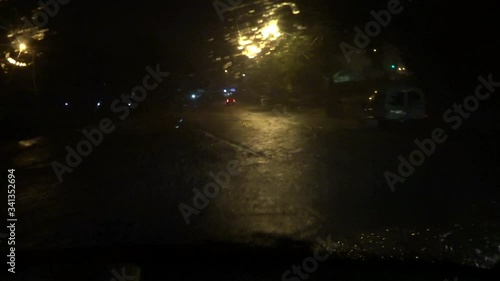 Night rain in the city - a flood in front of the car
